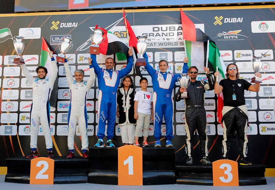 DUBAI, UNITED ARAB EMIRATES - APRIL 16: (L-R) Second, First, and Third place winners Salem Al Adidi and Eisa Al Ali of Dubai, Arif Al Zaffain and Nadir Bin Hendi of Victory Team and Giovanni Carpitella and Luca Fendi of T-Bone Station celebrate winning the Dubai Duty Free Speed Cat Run at the Dubai Grand Prix - the Second round of the UIM World Series where 14 boats ae competing at Dubai International Marine Club on April 16, 2016 in Dubai, United Arab Emirates. XCAT, short for extreme catamaran, is one of the most challenging and extreme forms of powerboat racing in the world. (Photo by Darren Arthur/Getty Images for XCAT)